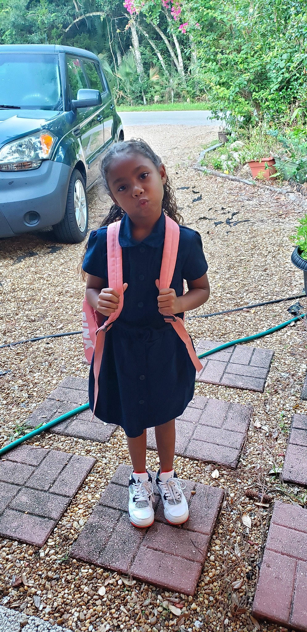 Tay is registered to the contest to win money with this photo: car, child, city_car, family_car, footwear, hatchback, minivan, person, photography, plant, shoe, sidewalk, subcompact_car, summer, toyota, vacation, vehicle, vehicle_door