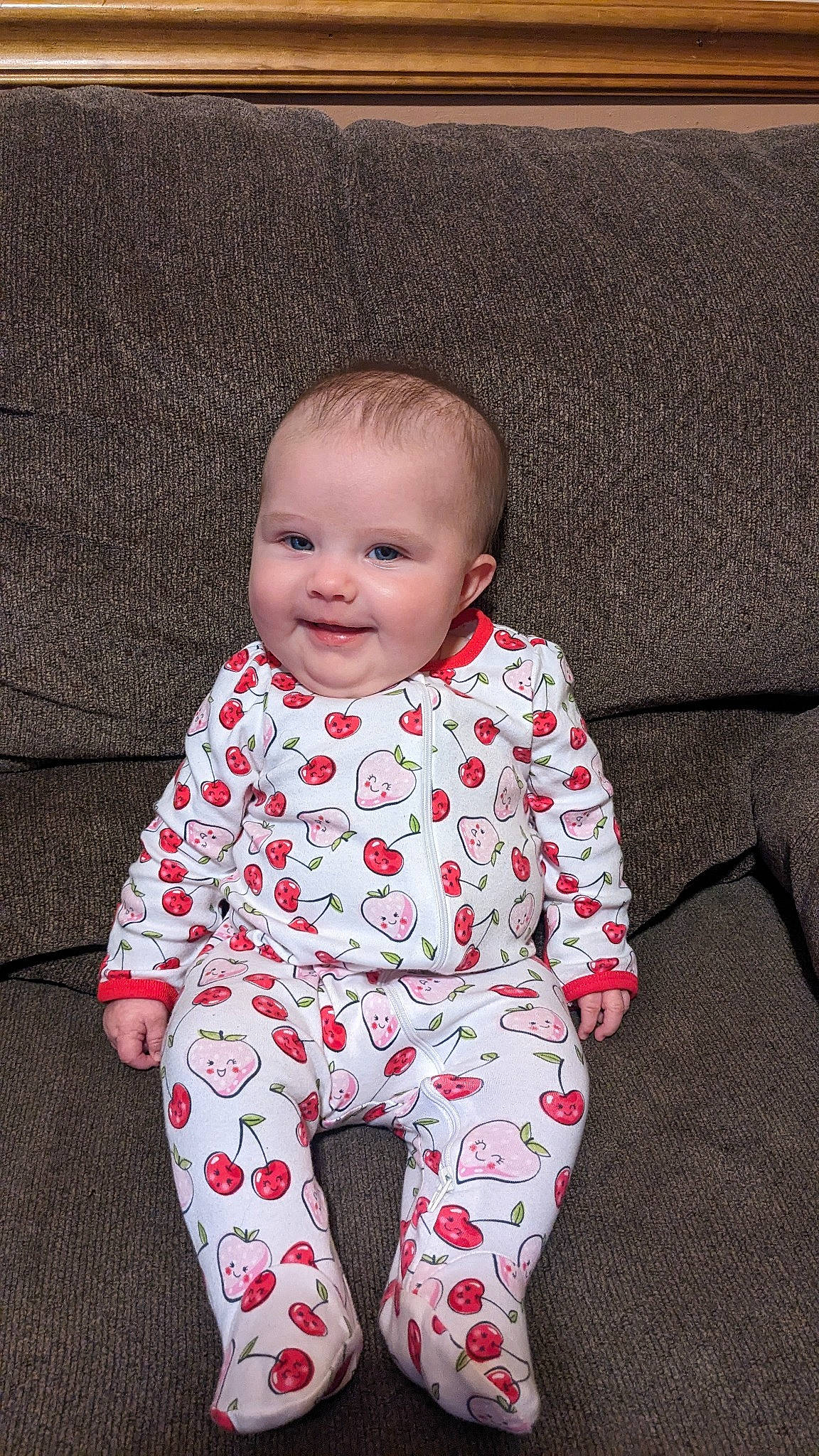 Katherine is registered to the contest to win money with this photo: baby, baby_toddler_clothing, carmine, child, clothing, comfort, eye, face, flooring, fun, happy, head, joy, knee, linens, pattern, person, sleeve, smile, t_shirt