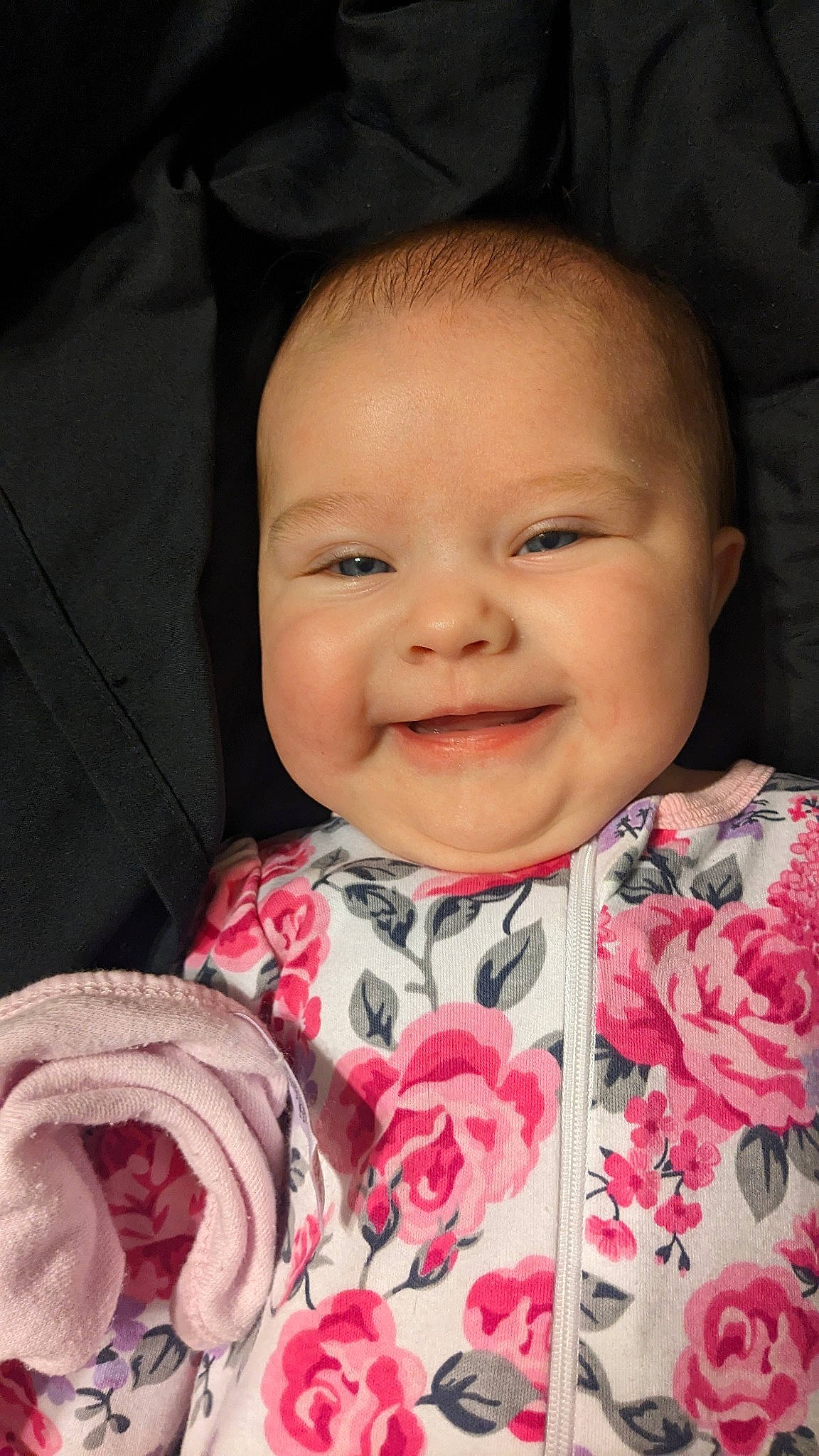 Katherine is registered to the contest to win money with this photo: baby, cheek, chin, eyebrow, facial_expression, flower, happy, human, iris, joy, lip, organ, person, petal, photograph, pink, plant, product, skin, smile