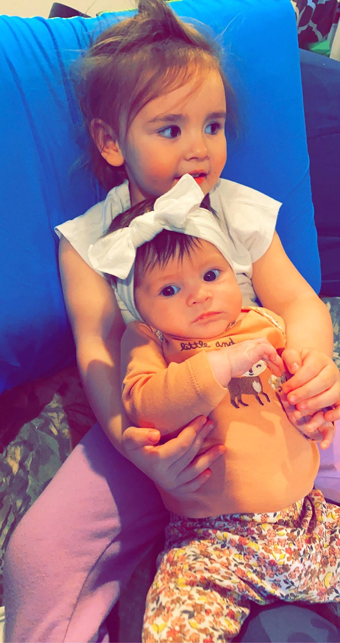 Hadley is registered to the contest to win money with this photo: arm, azure, blue, cheek, eye, face, gesture, hair, hand, happy, head, headwear, human_body, interaction, iris, joint, mouth, nose, person, shoulder