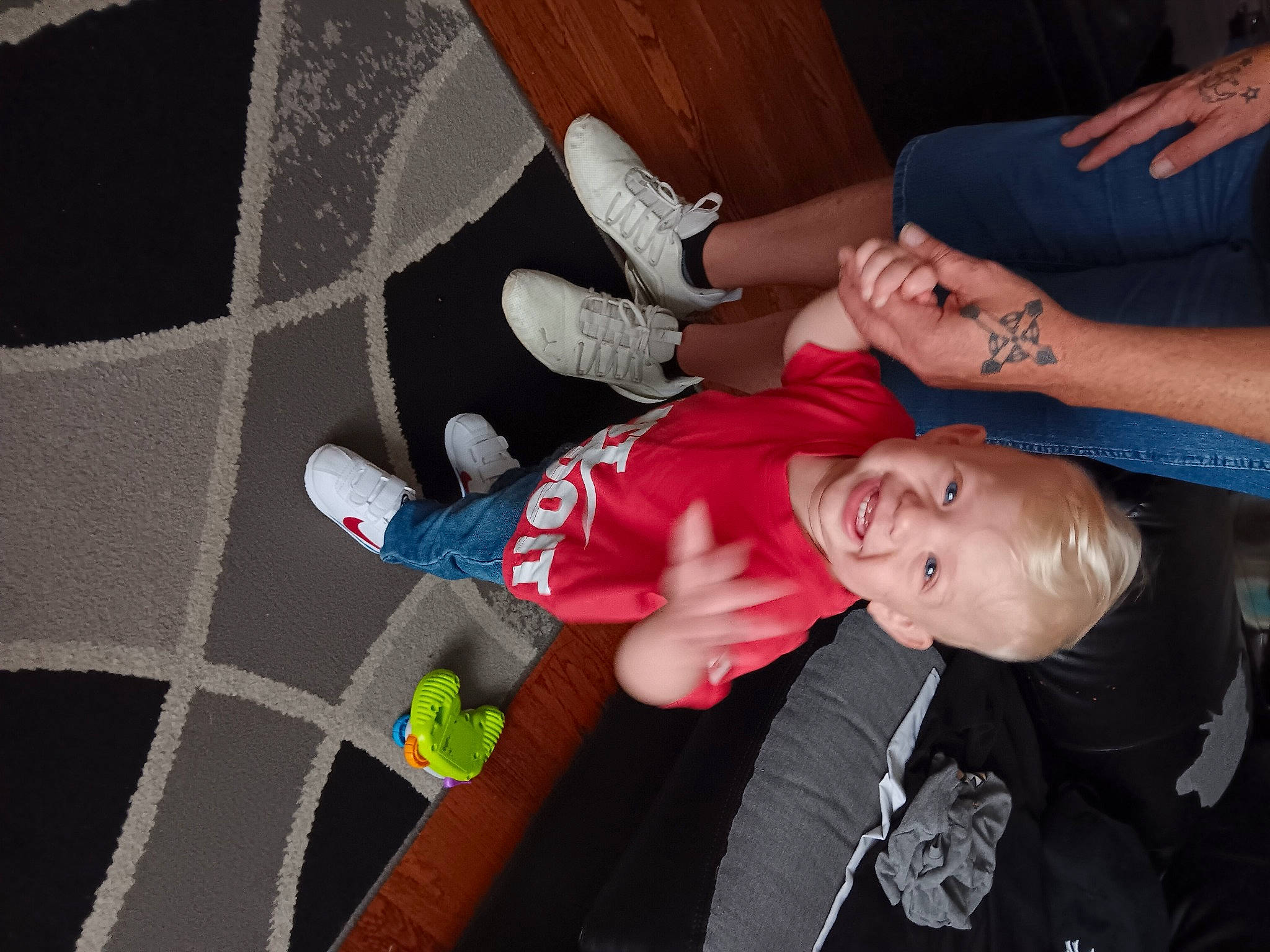 Troy joined the competition — help win amazing prizes! baby, baby_products, carmine, child, elbow, event, finger, flooring, fun, gesture, happy, human_leg, joint, joy, lap, person, sitting, sock, thigh, toddler