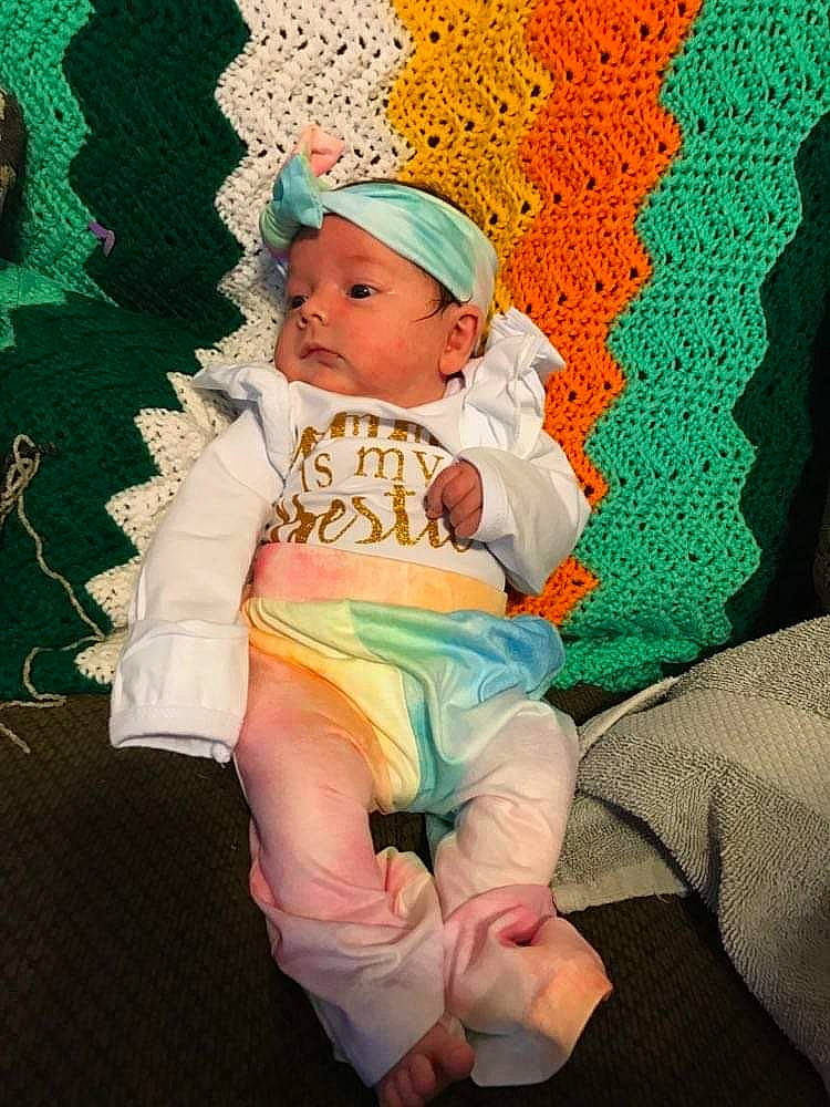 Olivia joined the competition — help win amazing prizes! art, baby, baby_toddler_clothing, barefoot, cap, chair, cheek, child, comfort, foot, fun, grass, happy, headgear, headwear, lap, linens, pattern, person, sitting