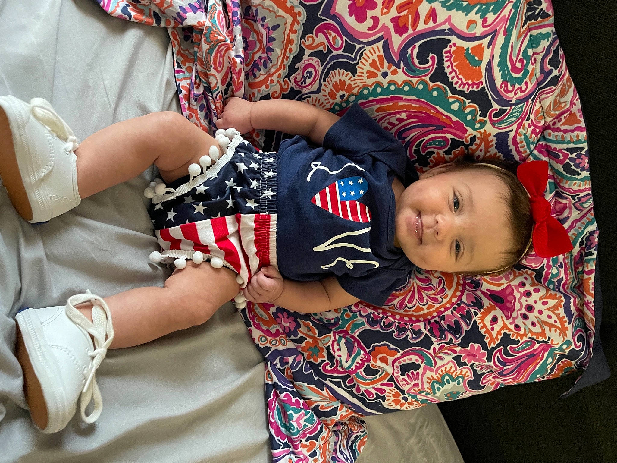 Harlan is registered to the contest to win money with this photo: arm, baby, baby_toddler_clothing, child, cool, facial_expression, hairstyle, hand, happy, headgear, human_body, human_leg, pattern, person, skin, sleeve, t_shirt, textile, thigh, toddler