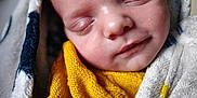Mylo participe au concours pour gagner de l'argent avec cette photo : baby, sleeping, blanket, yellow_sweater, cozy, closeup, face, infant, soft_texture, peaceful, child, knitwear, wrapped, indoors, portrait, newborn, resting, cute, warm, serene