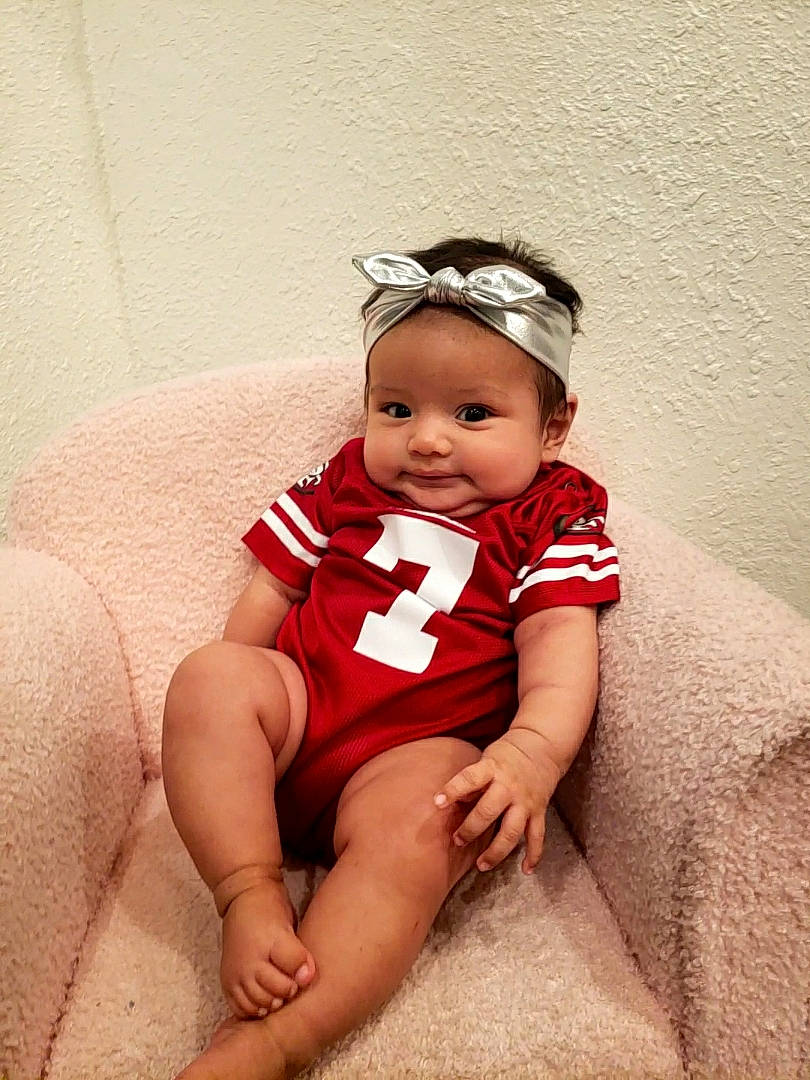 Shayla joined the competition — help win amazing prizes! abdomen, baby, baby_toddler_clothing, child, comfort, embellishment, eye, fashion_accessory, flash_photography, foot, happy, headband, headpiece, human_leg, jewellery, knee, person, sitting, thigh, toddler