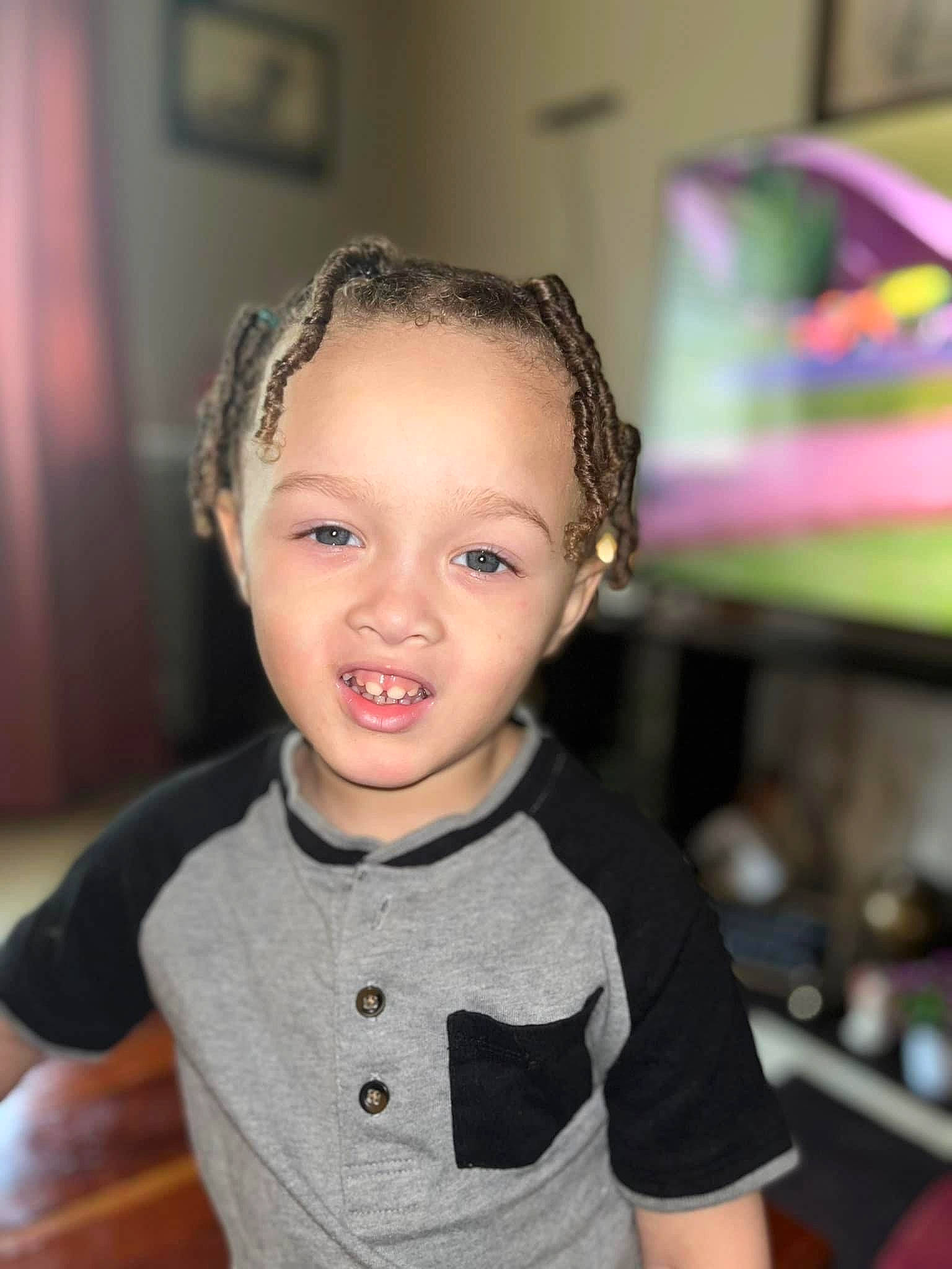 Isaiah is registered to the contest to win money with this photo: audio_equipment, baby_toddler_clothing, cheek, child, cool, ear, eyelash, fashion_accessory, flash_photography, fun, hairstyle, happy, iris, person, picture_frame, room, skin, sleeve, smile, t_shirt