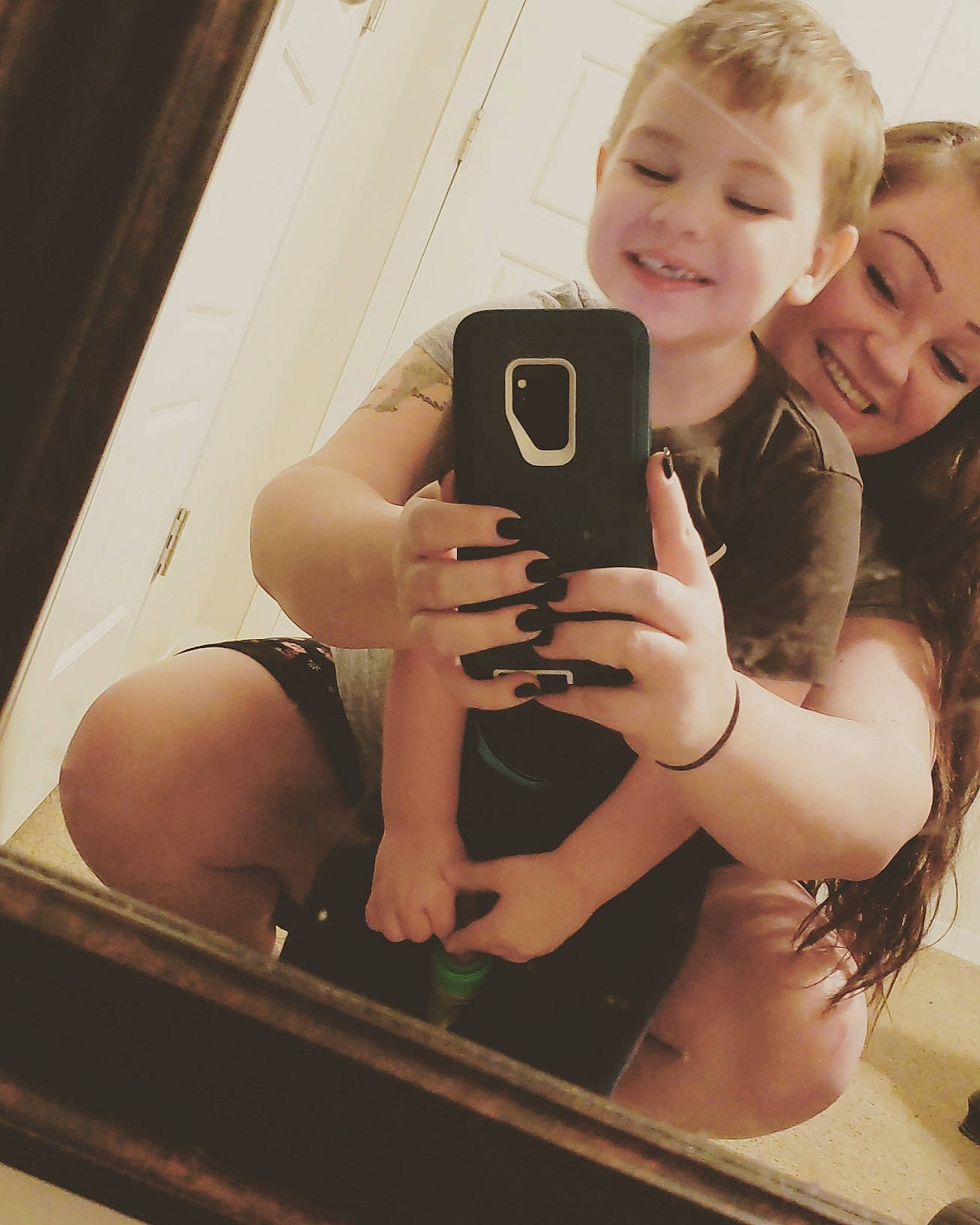 Carson is registered to the contest to win money with this photo: abdomen, blond, brown_hair, camera, cameras_optics, child, hair, hairstyle, joy, leg, long_hair, mirror, muscle, person, photography, selfie, smile, thigh, trunk, vacation