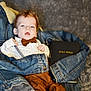 baby, infant, denim_jacket, bow_tie, suspenders, holy_bible, blanket, clothing, portrait, cute, indoor, person, child, soft_texture, lying_down, curious, young, face, fashion, casual