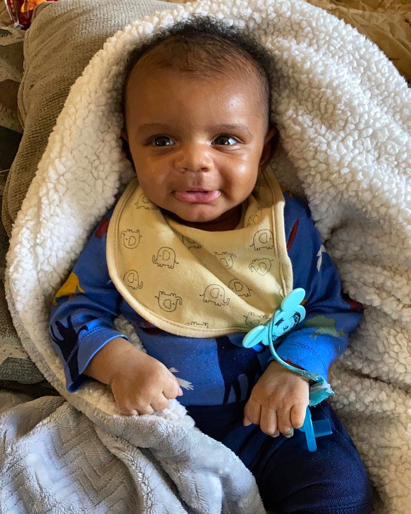 Dallas joined the competition — help win amazing prizes! baby, baby_products, baby_toddler_clothing, blue, cheek, child, eye, face, finger, hand, happy, head, iris, lip, nose, person, sitting, skin, smile, textile