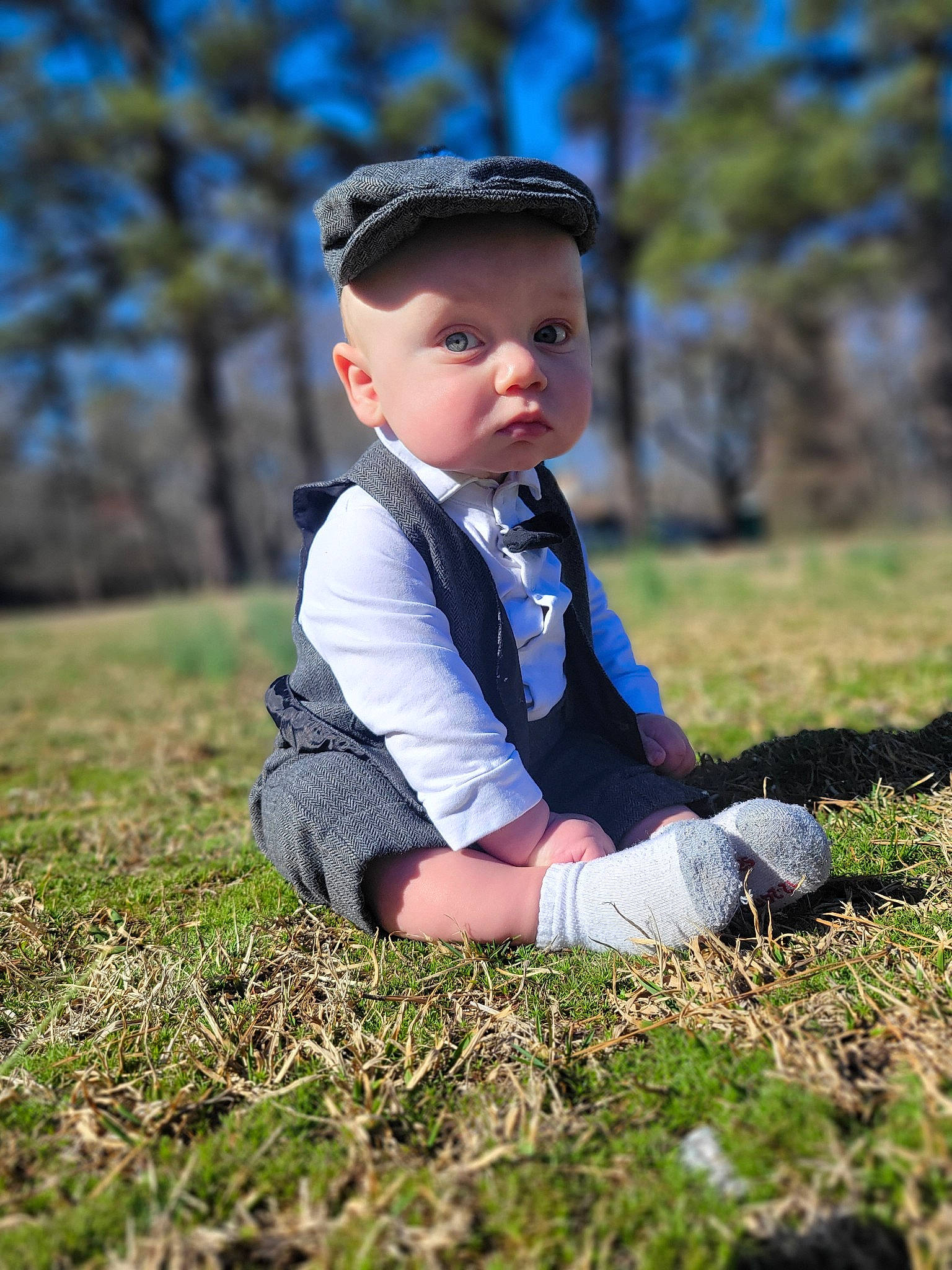 Felix joined the competition — help win amazing prizes! baby, baby_toddler_clothing, child, electric_blue, flash_photography, formal_wear, grass, grass_family, grassland, happy, headwear, landscape, people_in_nature, person, plant, portrait_photography, prairie, sitting, sky, toddler