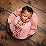 baby, child, closeup, cozy, cute, feet, hands, indoors, infant, newborn, peaceful, pink_blanket, portrait, resting, sleeping, soft_texture, swaddled, wood_floor, wooden_bowl, wrapped