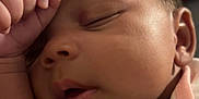 Layauna is registered to the contest to win money with this photo: baby, sleeping, face, hand, infant, closeup, peaceful, skin, ear, eyelid, mouth, clothing, soft, newborn, portrait, cute, resting, indoors, child, young