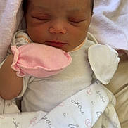 Layauna is registered to the contest to win money with this photo: newborn, baby, sleeping, blanket, mitten, pink, white, face, infant, cute, peaceful, soft, wrapped, child, portrait, closeup, indoors, resting, person, newborn_baby