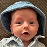 baby, infant, face, hat, clothing, blue_hat, expression, texture, blanket, portrait, cute, wide_eyes, mouth_open, indoor, child, young_child, closeup, skin, headwear, person