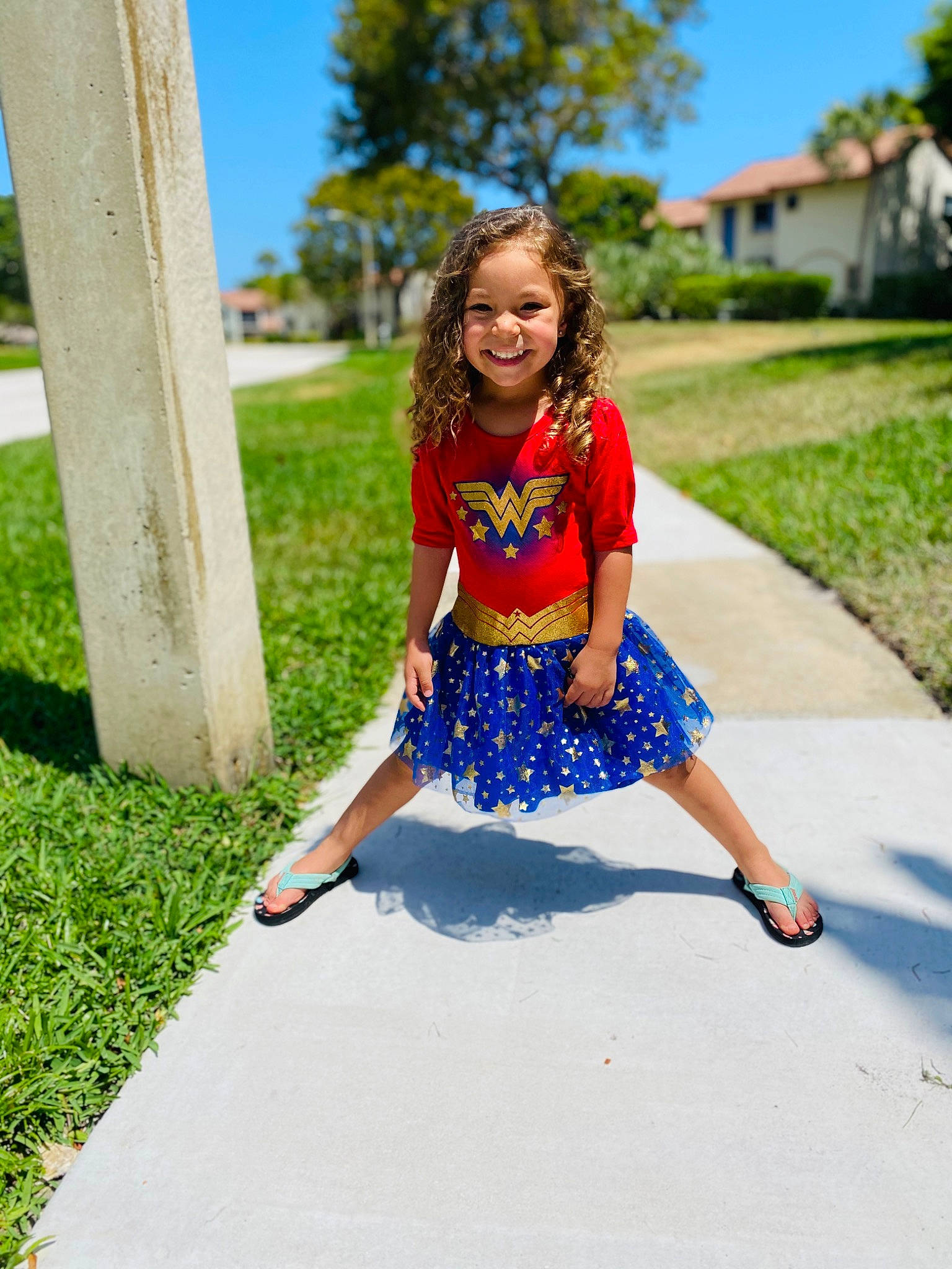 Kaydence is registered to the contest to win money with this photo: blue, child, cobalt_blue, dress, electric_blue, fashion, fun, grass, happy, joy, pattern, person, photo_shoot, photography, plant, recreation, red, smile, summer, toddler