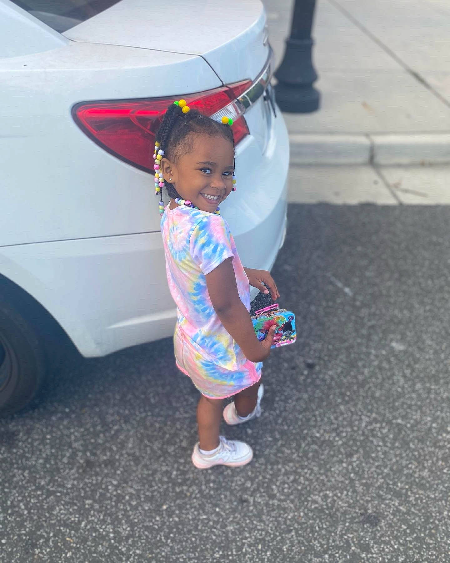 Alaiyah is registered to the contest to win money with this photo: asphalt, automotive_design, automotive_exterior, automotive_lighting, automotive_tail_brake_light, automotive_tire, automotive_wheel_system, baby_toddler_clothing, bumper, car, hood, joy, land_vehicle, motor_vehicle, person, pink, tints_and_shades, tire, trunk, vehicle