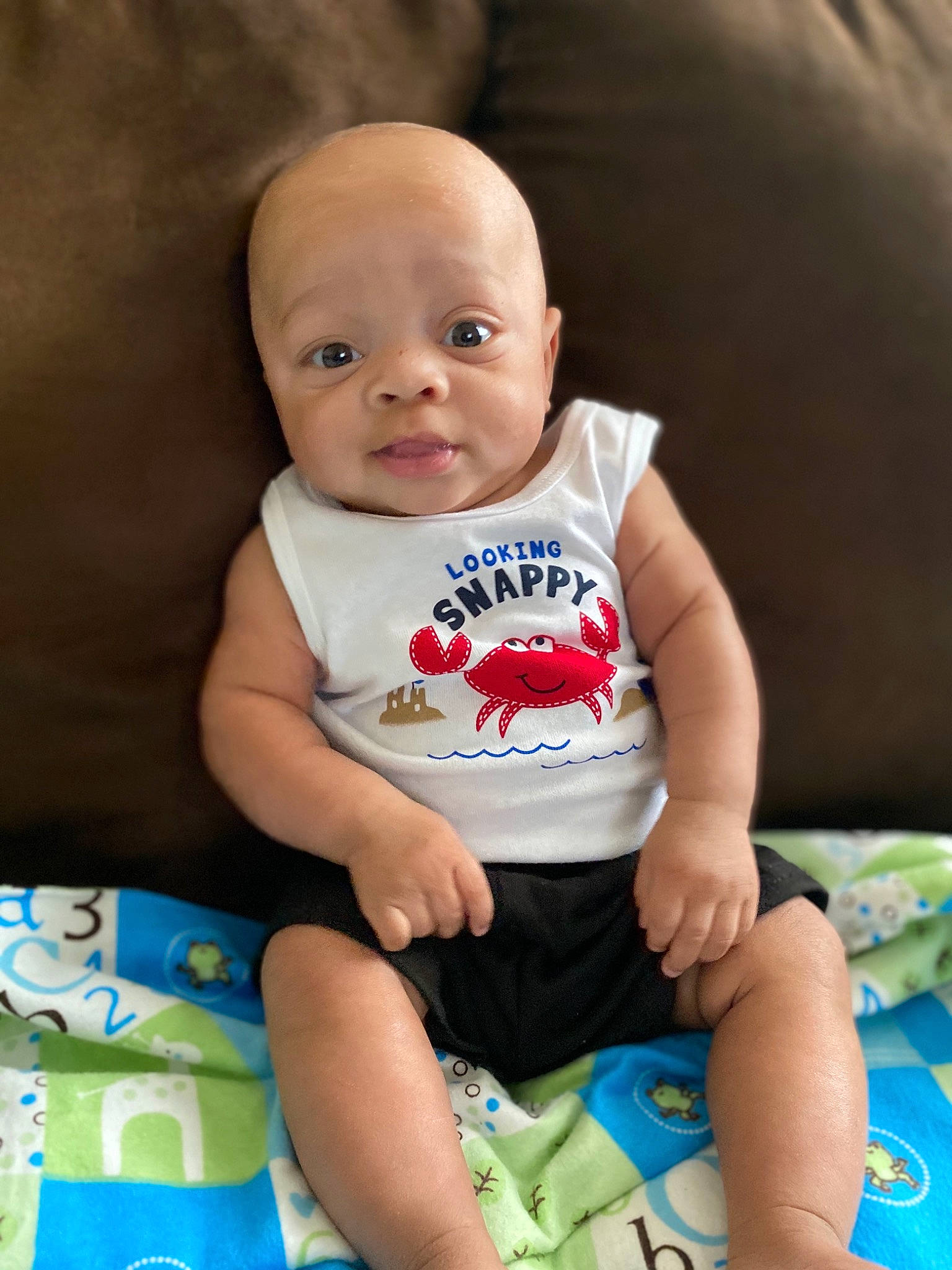 Kacen is registered to the contest to win money with this photo: baby, baby_products, baby_toddler_clothing, cheek, child, diaper, eye, face, head, person, play, product, sitting, skin, t_shirt, toddler, tummy_time, vacation