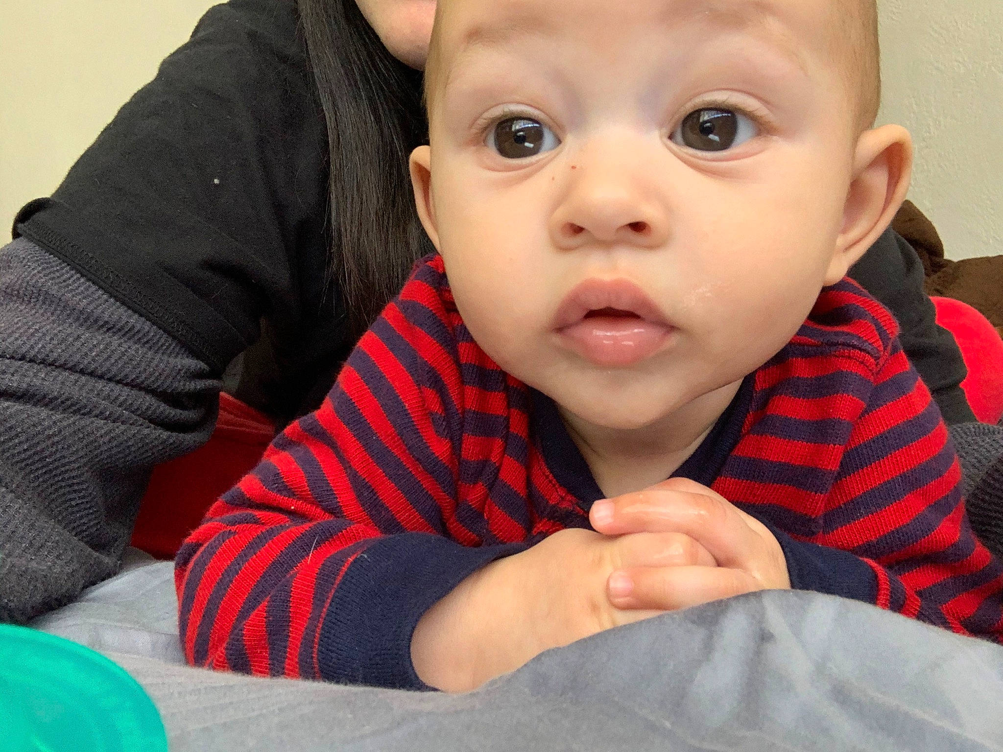 Julien is registered to the contest to win money with this photo: baby, cheek, child, chin, ear, eye, face, finger, forehead, gesture, hand, head, iris, lip, mouth, nail, nose, person, skin, surprise