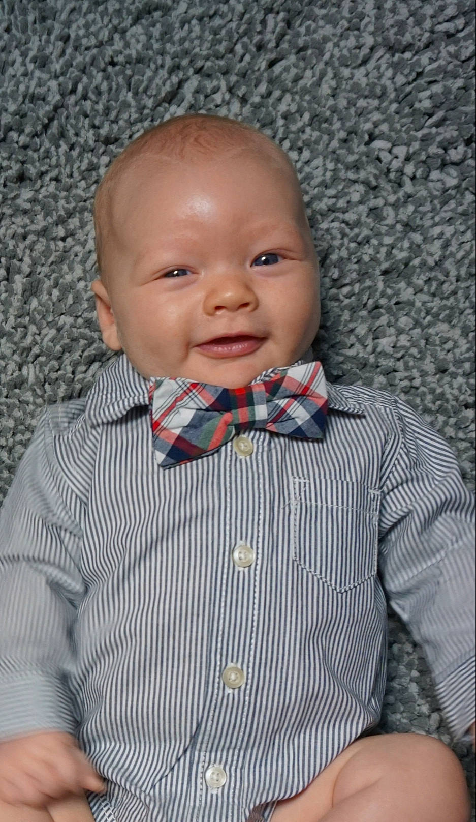 Graycen joined the competition — help win amazing prizes! baby, bow_tie, cheek, child, chin, face, head, nose, pattern, person, plaid, skin, smile, tie, toddler