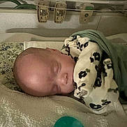 Aurora joined the competition — help win amazing prizes! baby, sleeping, blanket, pacifier, towel, infant, face, head, cozy, rest, nursery, soft_lighting, clothing, child, peaceful, indoors, closeup, newborn, comfort, portrait