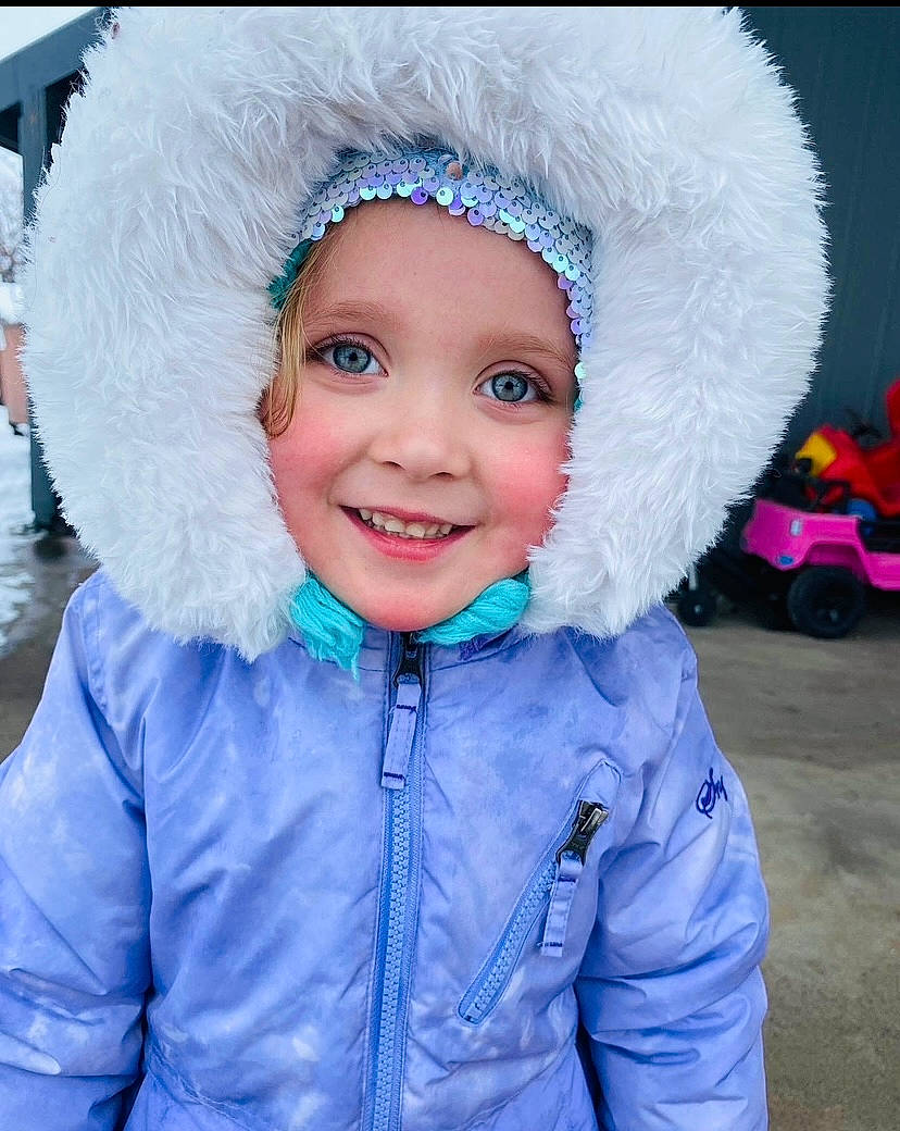 Ellianna is registered to the contest to win money with this photo: cap, costume_hat, electric_blue, freezing, fun, fur_clothing, glove, happy, hat, headgear, headwear, jacket, joy, magenta, person, pink, purple, sleeve, smile, snow