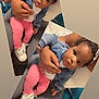 baby, child, woman, denim_jacket, pink_pants, sparkly_shoes, indoor, sitting, curious_expression, holding, lap, hand, face, person, footwear, clothing, home, couch, pillow, tattoo