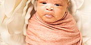 Kru is registered to the contest to win money with this photo: adorable, baby, baby_face, blanket, closeup, cozy, cute, floral, flower_headband, flower_petals, headband, infant, newborn, peaceful, portrait, soft_lighting, soft_texture, swaddled, white_background, wrapped