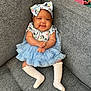 Kru is registered to the contest to win money with this photo: baby, child, smiling, dress, headband, blue, white_socks, couch, gray, indoor, cute, happy, person, infant, sitting, clothing, portrait, furniture, comfortable, baby_fashion