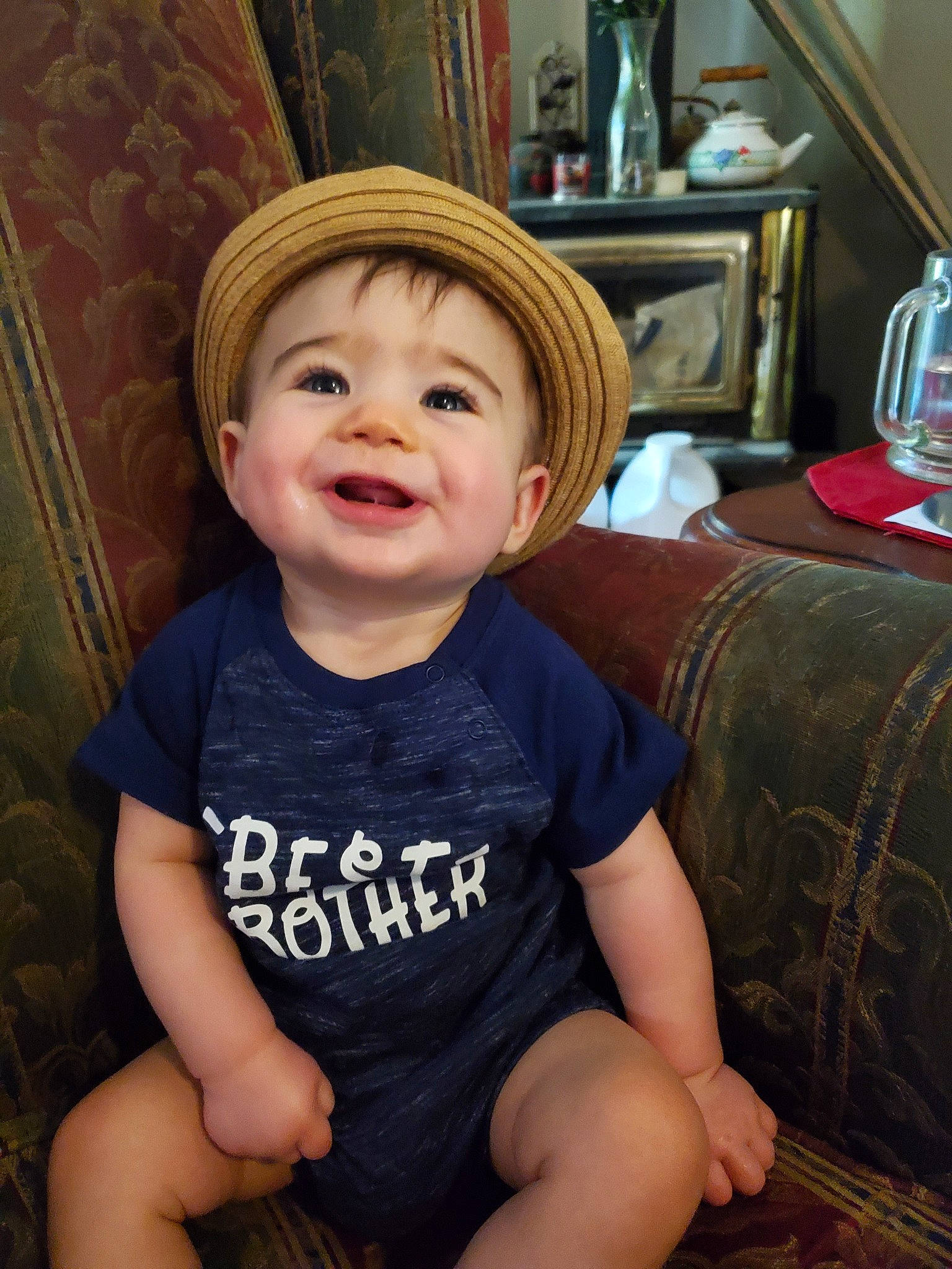 Ricky is registered to the contest to win money with this photo: cheek, child, chin, cool, eye, face, head, joy, leg, person, sitting, smile, toddler