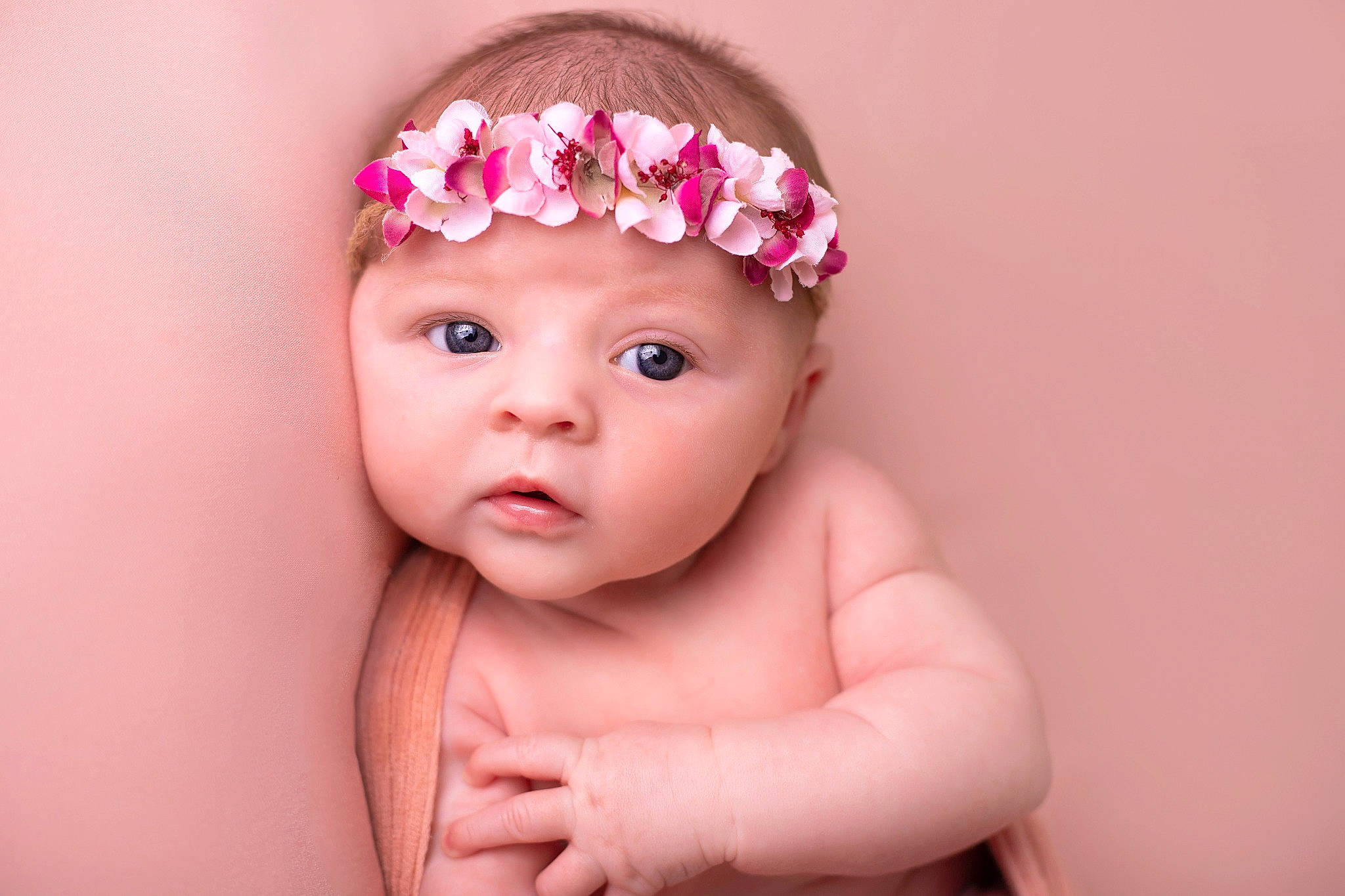 Rosie participe au concours pour gagner de l'argent avec cette photo : baby, cheek, child, child_model, fashion_accessory, flower, hair_accessory, hand, headband, headgear, headpiece, headwear, lip, person, petal, photography, pink, plant, portrait_photography, skin