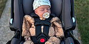 Arwen joined the competition — help win amazing prizes! baby, infant, car_seat, stroller, pacifier, hat, sleeping, outdoor, pathway, grass, clothing, socks, child, seatbelt, newborn, toddler, cute, bundle, babywear, carrying