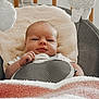 Arwen joined the competition — help win amazing prizes! baby, infant, baby_chair, blanket, plush_toy, cushion, face, person, indoors, comfort, child, resting, cute, soft_texture, newborn, clothing, seatbelt, baby_bedding, portrait, relaxation
