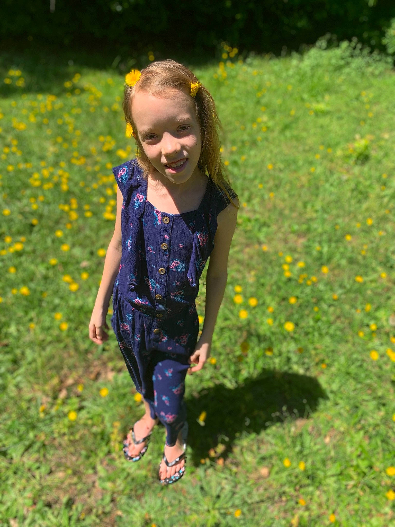 Kasidy is registered to the contest to win money with this photo: botany, child, flower, fun, grass, grassland, green, happy, joy, lawn, leaf, meadow, people_in_nature, person, plant, play, smile, spring, summer, sunlight