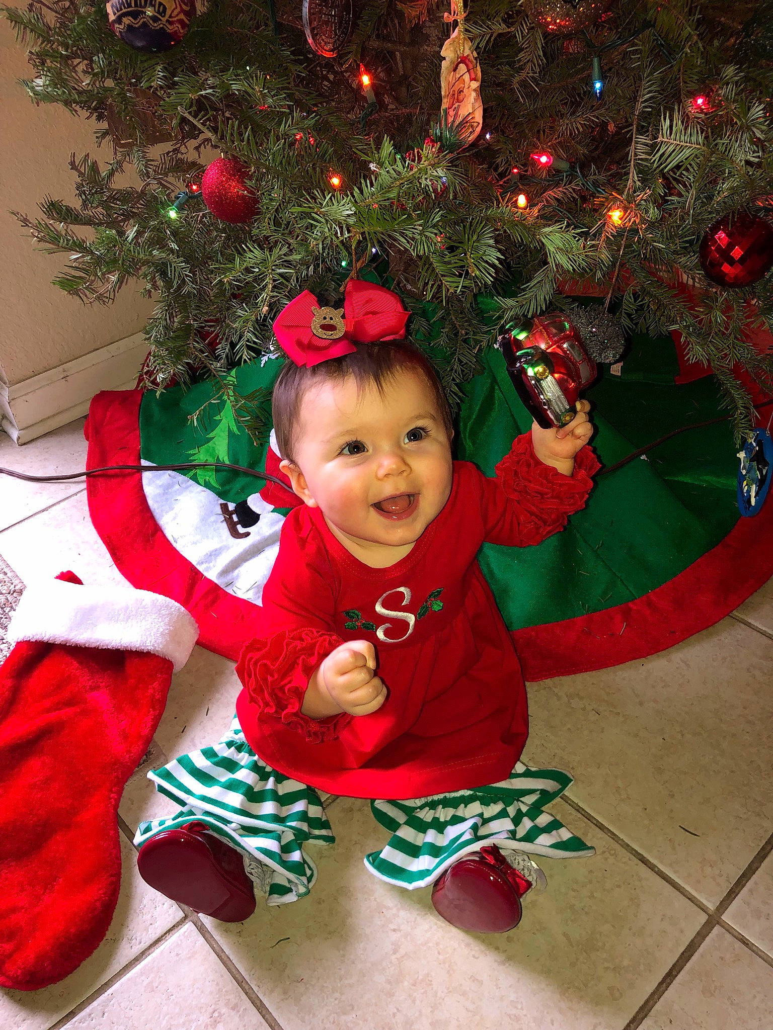 Sadie Grace joined the competition — help win amazing prizes! baby, child, christmas, christmas_decoration, christmas_eve, christmas_lights, christmas_ornament, christmas_stocking, christmas_tree, event, fictional_character, fir, holiday, holiday_ornament, interior_design, person, pine_family, plant, smile, toddler