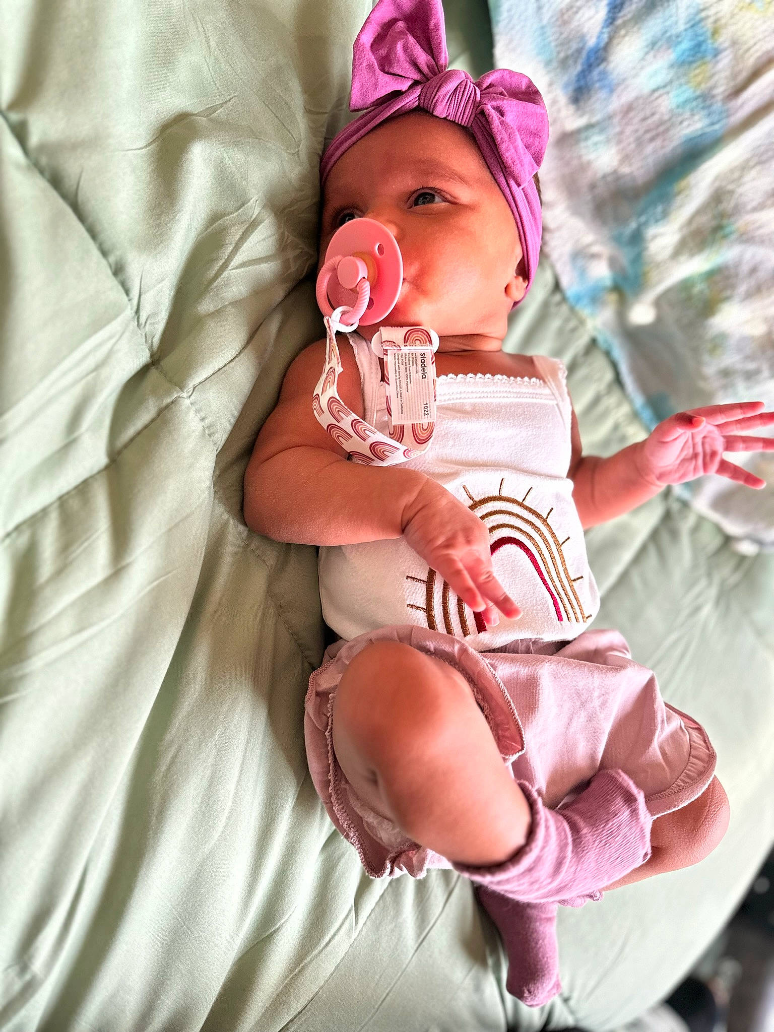 Brielle is registered to the contest to win money with this photo: baby, baby_products, baby_safety, baby_sleeping, baby_toddler_clothing, carmine, child, comfort, finger, hand, human_body, leg, linens, magenta, person, pink, sitting, skin, sleeve, thigh
