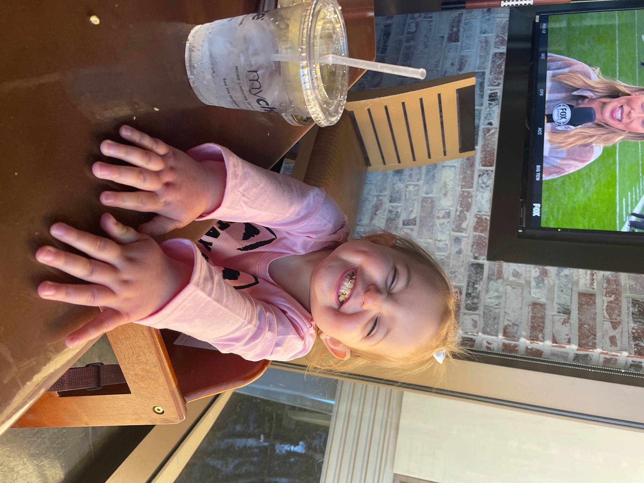 Adelyn is registered to the contest to win money with this photo: art, child, flat_panel_display, food, fun, headwear, joy, machine, organ, person, room, smile, snapshot, space, tableware, thumb, toddler, visual_arts, wood