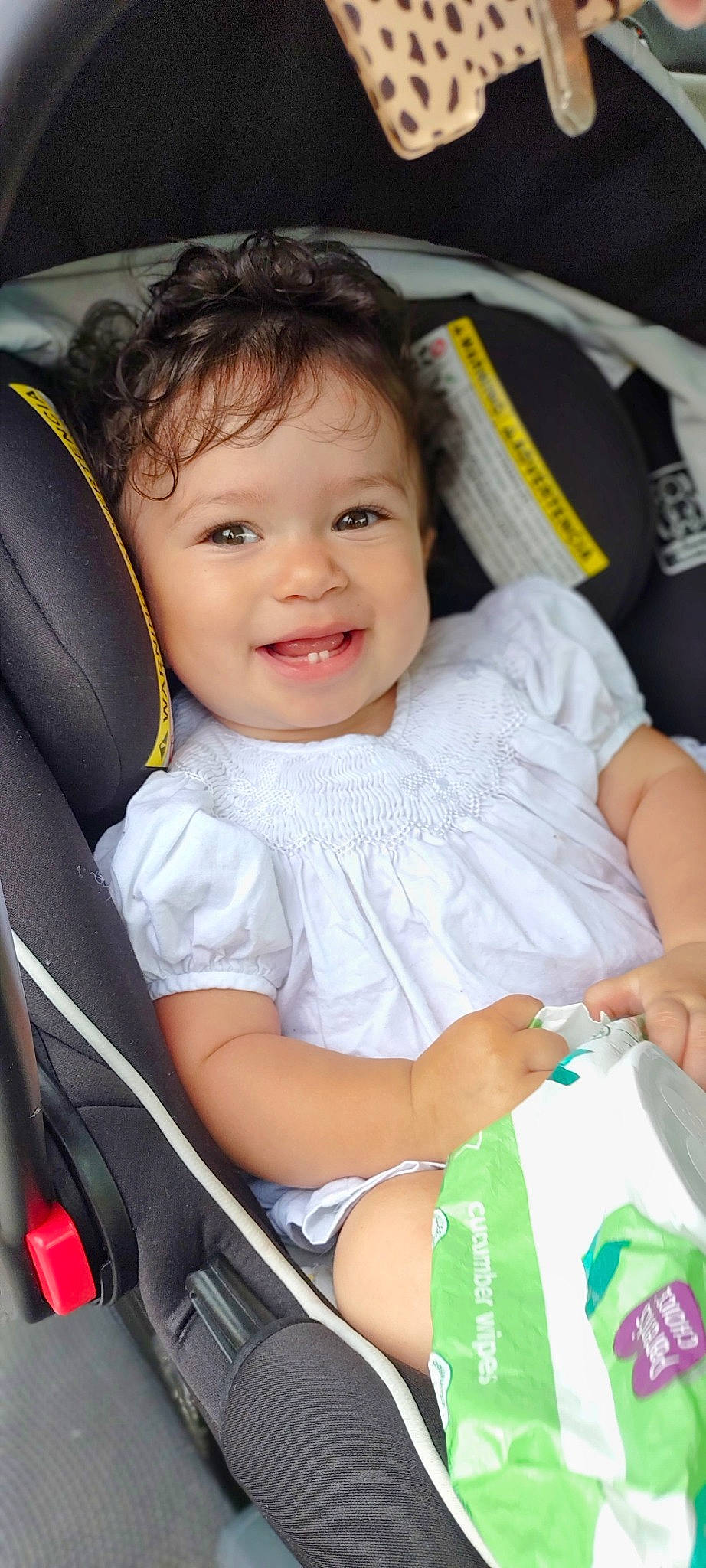 Madison is registered to the contest to win money with this photo: auto_part, automotive_design, baby, baby_carriage, baby_products, beauty, car_seat, child, comfort, finger, fun, happy, joy, motor_vehicle, person, sitting, skin, smile, steering_wheel, toddler