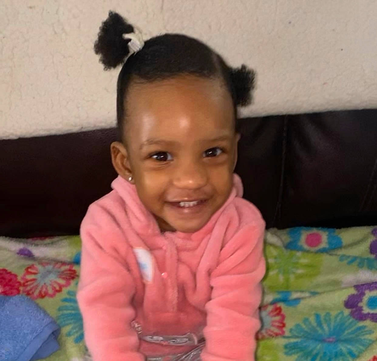 Amoura is registered to the contest to win money with this photo: baby, baby_toddler_clothing, black_hair, cheek, child, comfort, couch, ear, eye, eyebrow, face, forehead, happy, head, iris, joy, nose, person, skin, sleeve