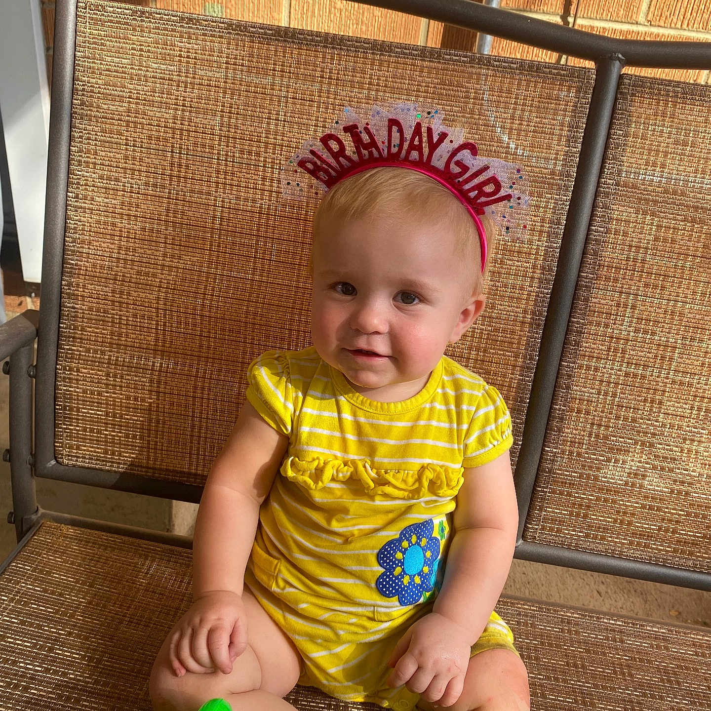 Julie Waibel is registered to the contest to win money with this photo: accessories, baby, ball, chair, clothing, face, football, furniture, happy, hat, head, jewelry, person, photography, portrait, sitting, soccer, soccerball, sport, t_shirt