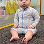 Malakai joined the competition — help win amazing prizes! baby, barefoot, carpet, casual, caution_sign, child, curious, expression, feet, floor, glass_wall, hands, indoor, playroom, portrait, sitting, striped_clothing, toddler, yellow_frame, young_child