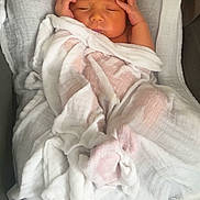 Milan participe au concours pour gagner de l'argent avec cette photo : newborn, baby, infant, wrapped, white_cloth, sleeping, hands, face, skin, soft, blanket, resting, cozy, indoors, closeup, peaceful, cute, small, portrait, child