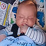 Sonny joined the competition — help win amazing prizes! baby, sleeping, car_seat, blanket, infant, child, dinosaur_pattern, striped_clothing, finger, peaceful, cute, cozy, seatbelt, head_support, indoor, close_up, soft_lighting, portrait, resting, comfort