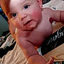 baby, infant, child, skin, face, hand, thumb_up, blanket, bed, indoor, cute, rosy_cheeks, expression, curious, young, person, human, soft_light, comfort, lying_down