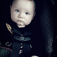 Otis joined the competition — help win amazing prizes! baby, baby_clothes, car_seat, child, closeup, clothing, cute, expression, face, hand, indoor, infant, looking_at_camera, person, portrait, safety, seat, seatbelt, straps, young_child