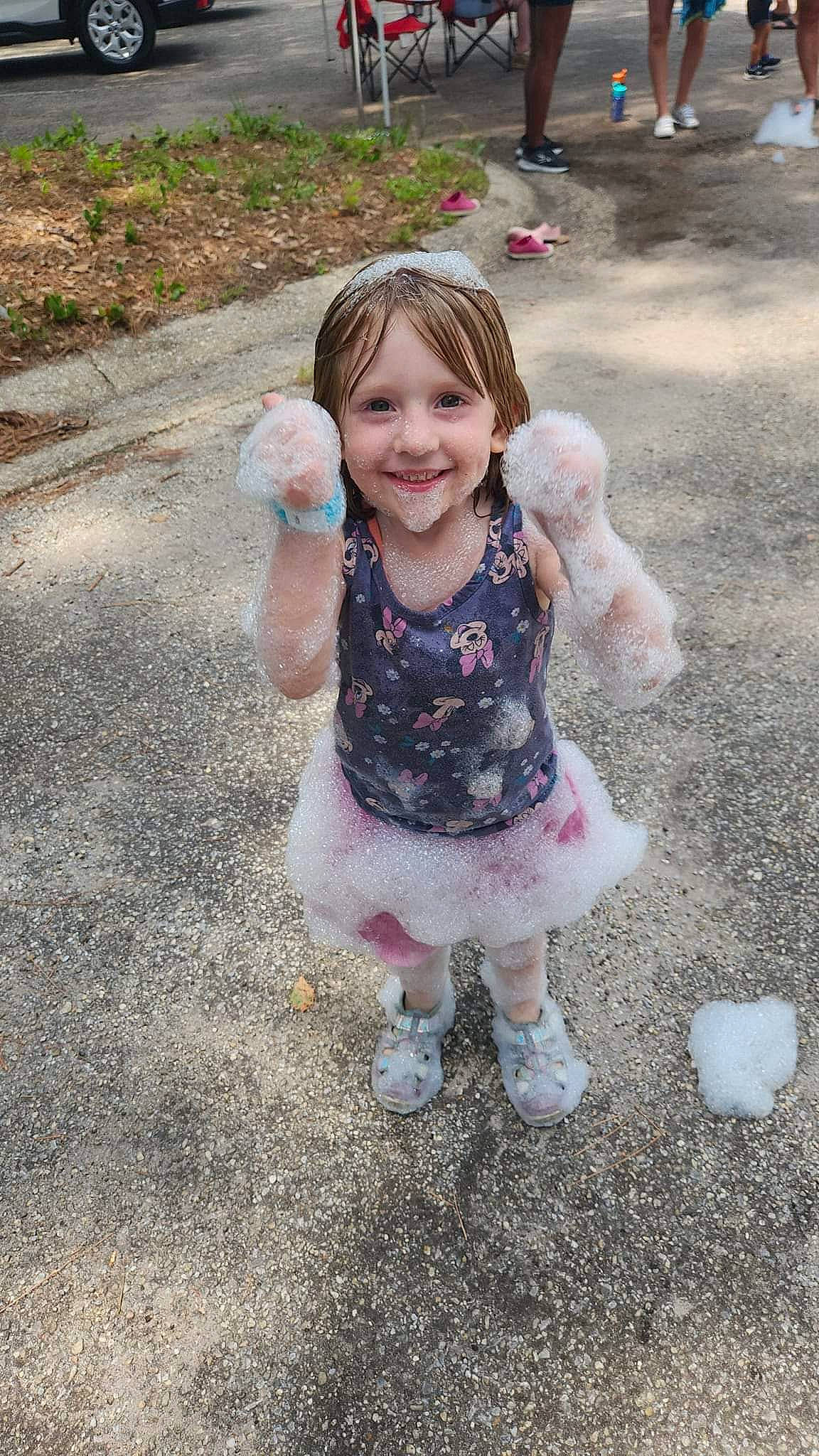 Rose is registered to the contest to win money with this photo: asphalt, child, eye, fun, gesture, grass, happy, joy, leaf, mammal, people_in_nature, person, photograph, pink, plant, road_surface, smile, soil, spring, thumb