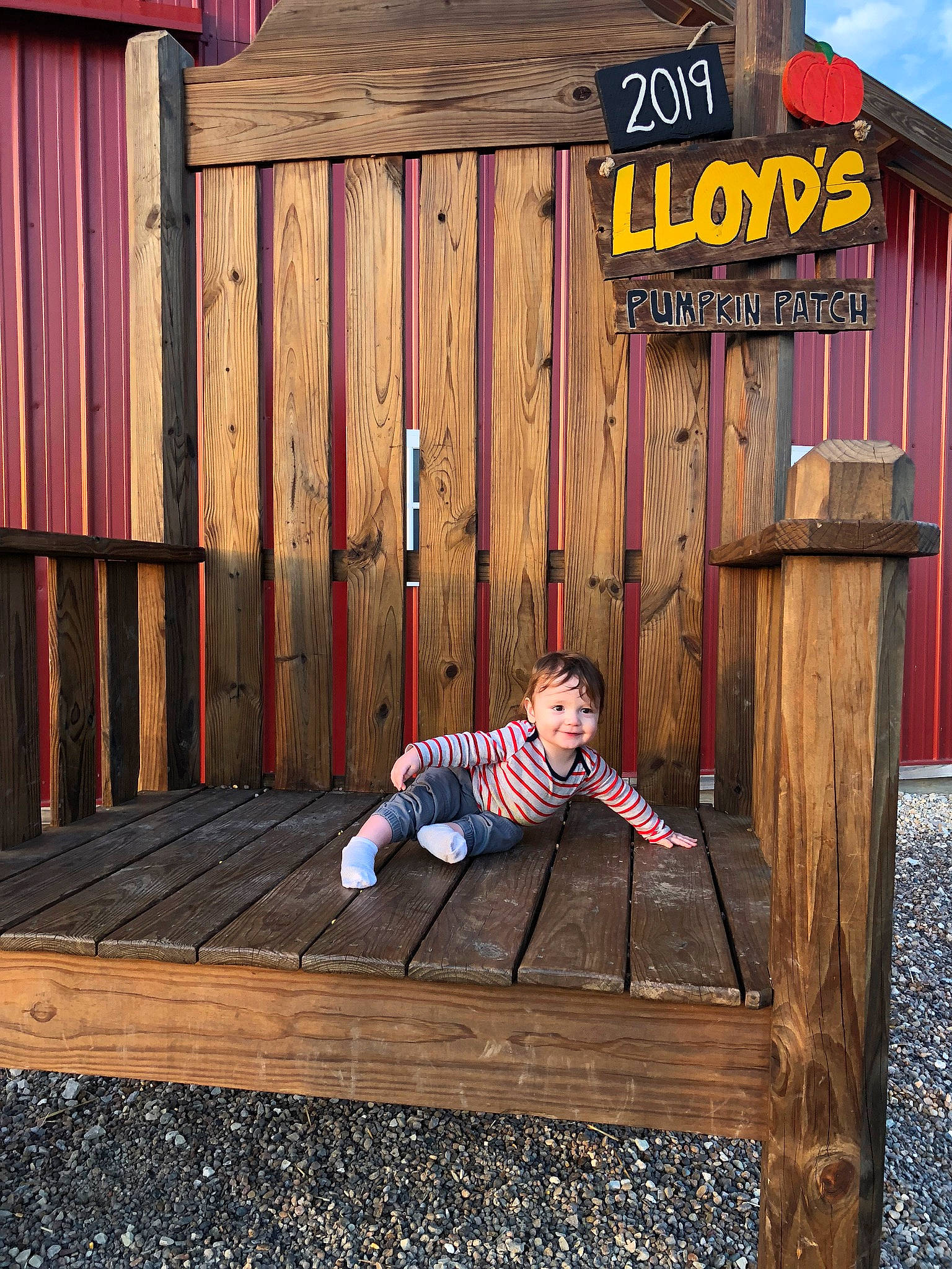 Keeton is registered to the contest to win money with this photo: deck, fence, flooring, fun, grass, hardwood, human_body, joy, leg, leisure, lumber, outdoor_furniture, people_in_nature, person, plank, product, rectangle, standing, tints_and_shades, wall