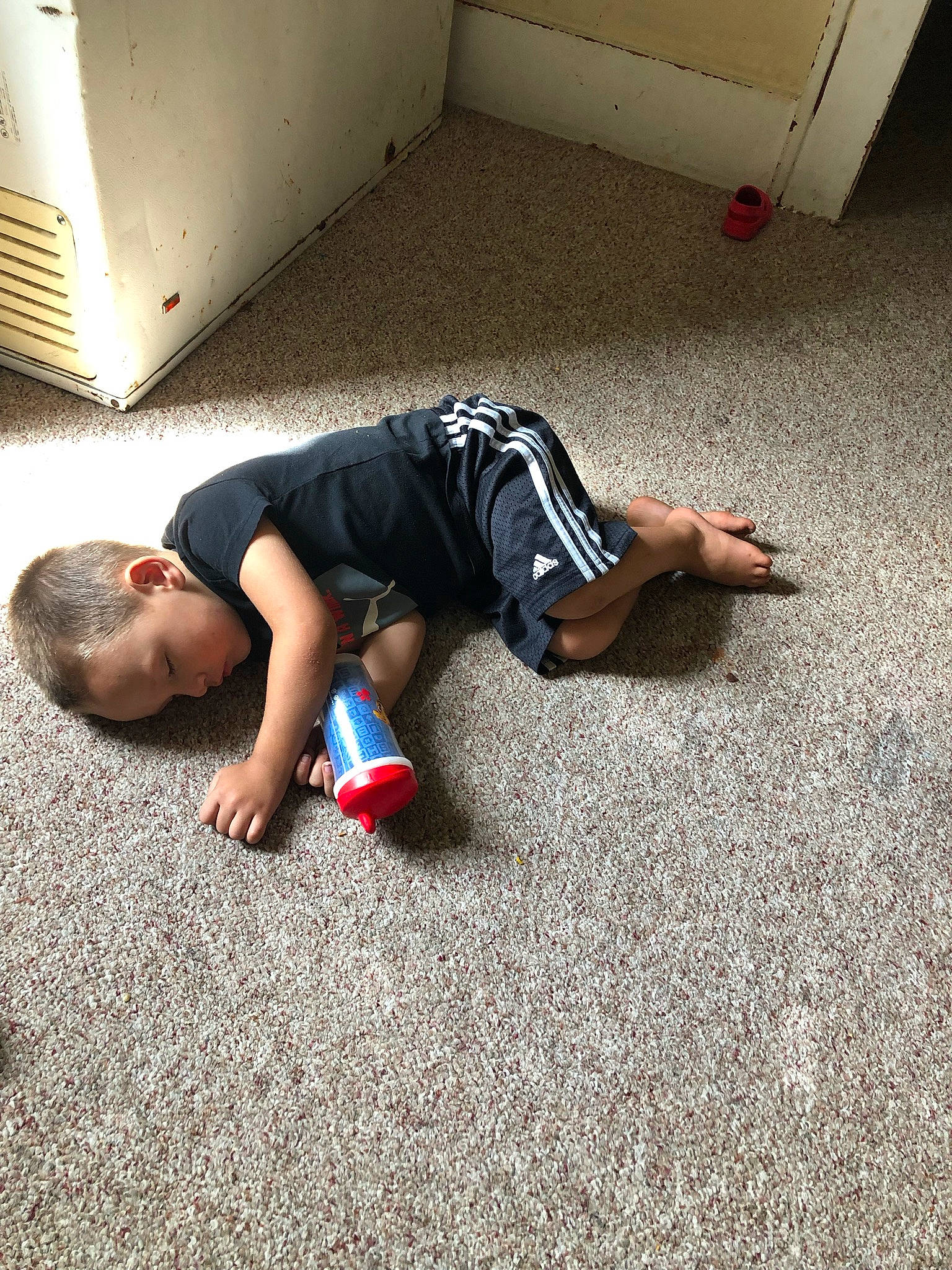 Kilynn is registered to the contest to win money with this photo: asphalt, automotive_design, comfort, elbow, floor, flooring, foot, grass, human_leg, joint, knee, leg, person, road_surface, shoe, shorts, sidewalk, sneakers, sportswear, t_shirt