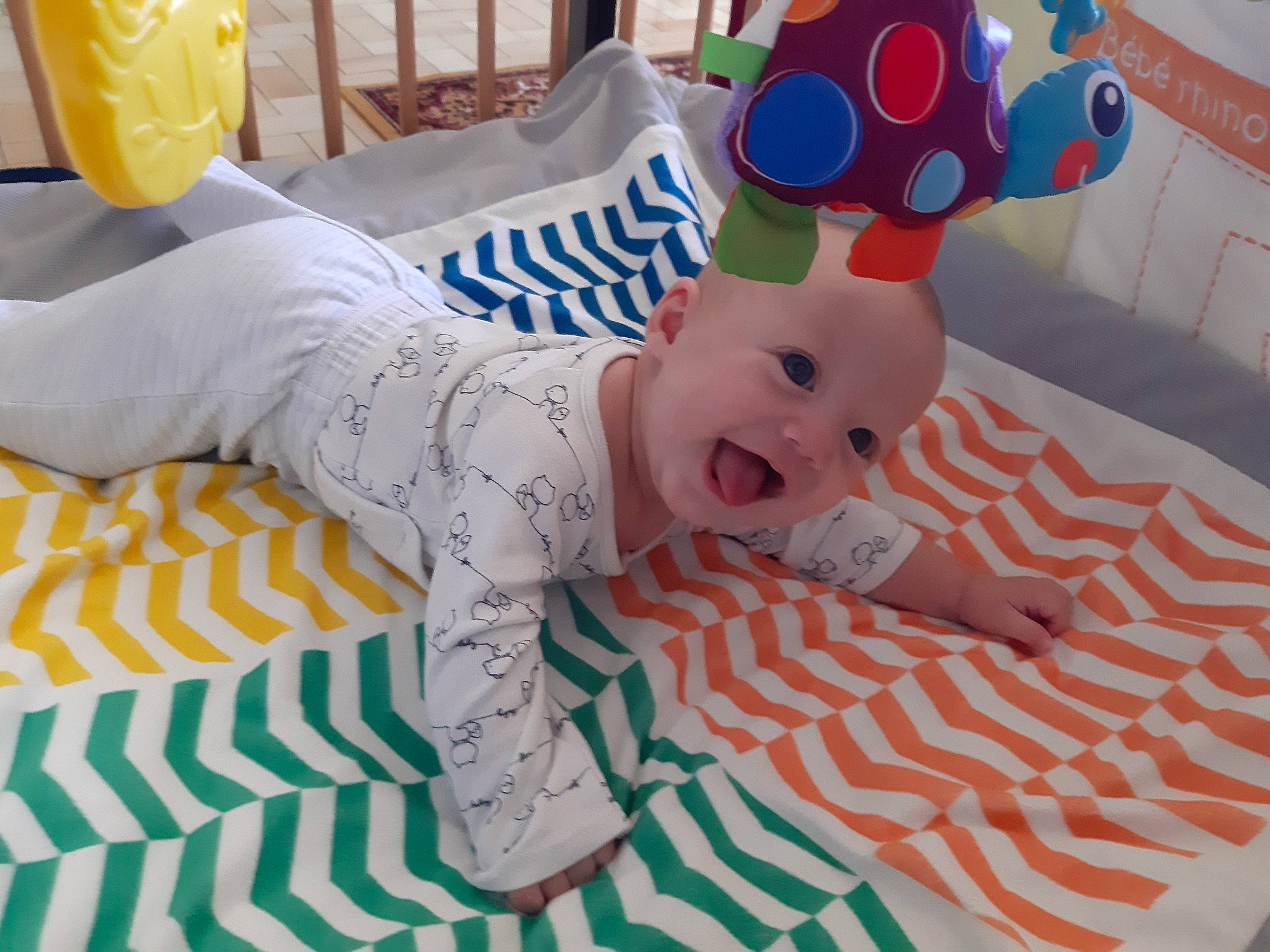 Hayden participe au concours pour gagner de l'argent avec cette photo : baby, baby_products, baby_toddler_clothing, baby_toys, carmine, child, flooring, fun, happy, leisure, linens, party_supply, pattern, person, plush, room, smile, stuffed_toy, textile, toddler