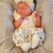 Bonnie joined the competition — help win amazing prizes! newborn, baby, sleeping, headband, bow, blanket, clothing, cute, infant, soft, fabric, portrait, rest, peaceful, small_hands, white, patterned, cozy, toddler, child