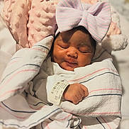 Normani joined the competition — help win amazing prizes! newborn, baby, sleeping, blanket, bow, pink, striped, hat, pillow, soft, cozy, wrapped, infant, cute, peaceful, resting, child, portrait, indoor, closeup